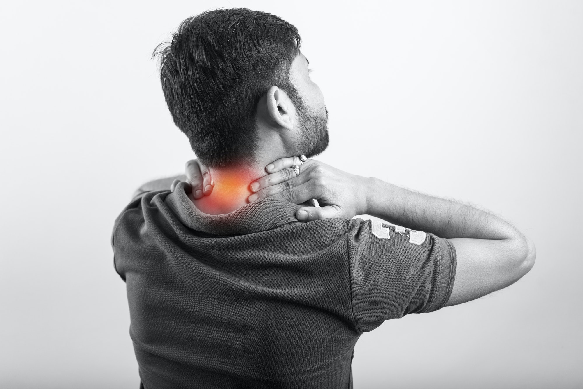 man suffering from neck pain, inflamed zone highlight with red color in white background